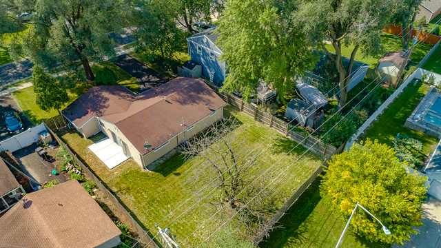 187 Queenswood Road Bolingbrook, IL 60440 - Photo 2 of 36 an aerial view of a house with swimming pool and garden