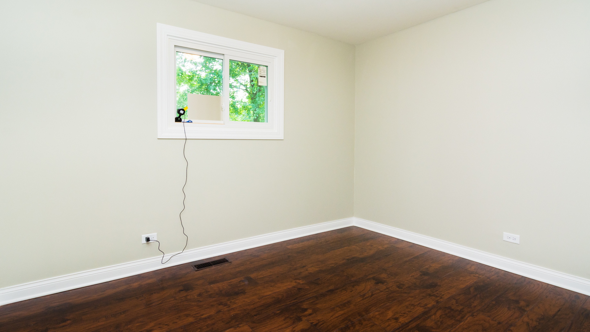 187 Queenswood Road Bolingbrook, IL 60440 - Photo 26 of 36 an empty room with wooden floor and windows