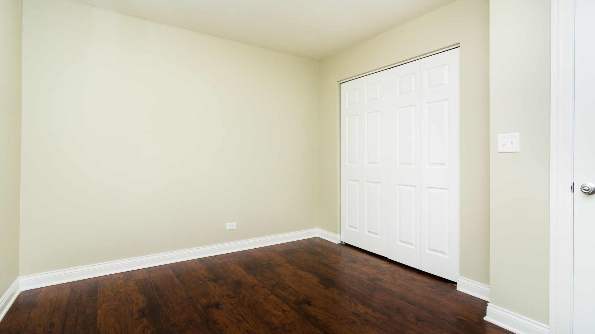 187 Queenswood Road Bolingbrook, IL 60440 - Photo 27 of 36 a view of an empty room with wooden floor
