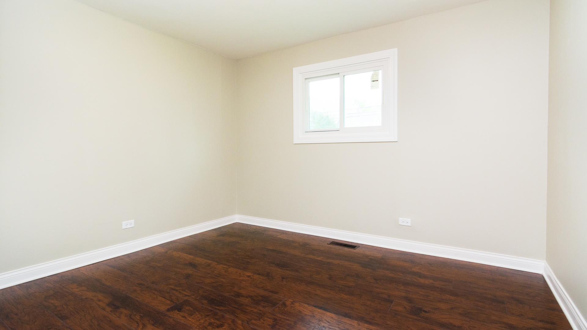 187 Queenswood Road Bolingbrook, IL 60440 - Photo 28 of 36 an empty room with wooden floor and windows