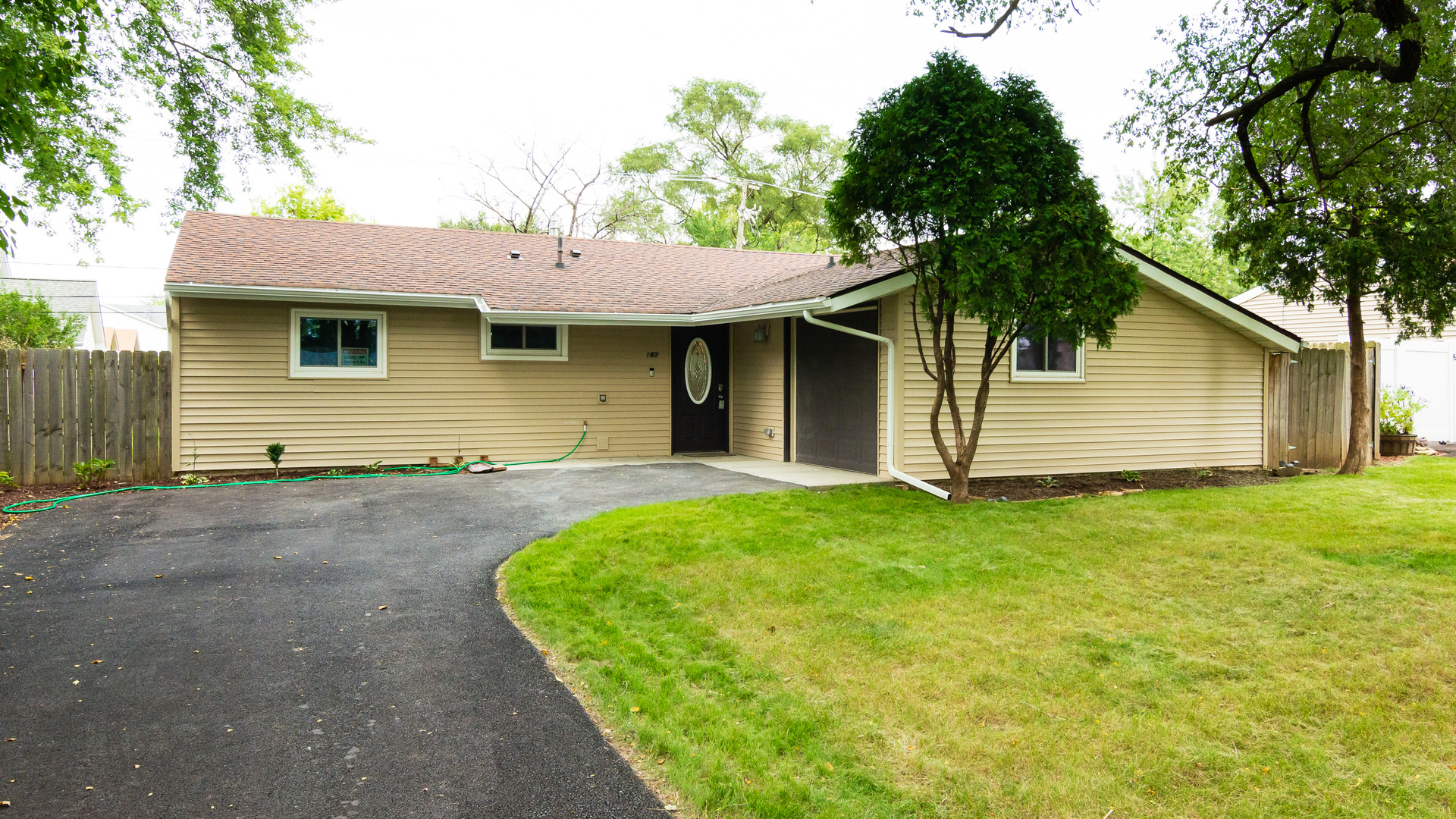 187 Queenswood Road Bolingbrook, IL 60440 - Photo 31 of 36 a front view of a house with garden