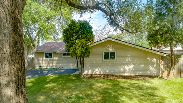187 Queenswood Road Bolingbrook, IL 60440 - Photo 32 of 36 a front view of a house with a yard