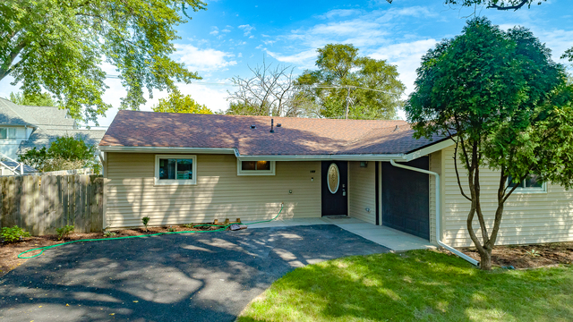 187 Queenswood Road Bolingbrook, IL 60440 - Photo 6 of 36 a front view of a house with garden