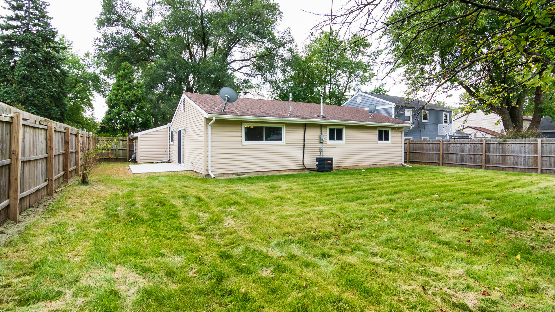 187 Queenswood Road Bolingbrook, IL 60440 - Photo 10 of 36 a view of a house with a yard