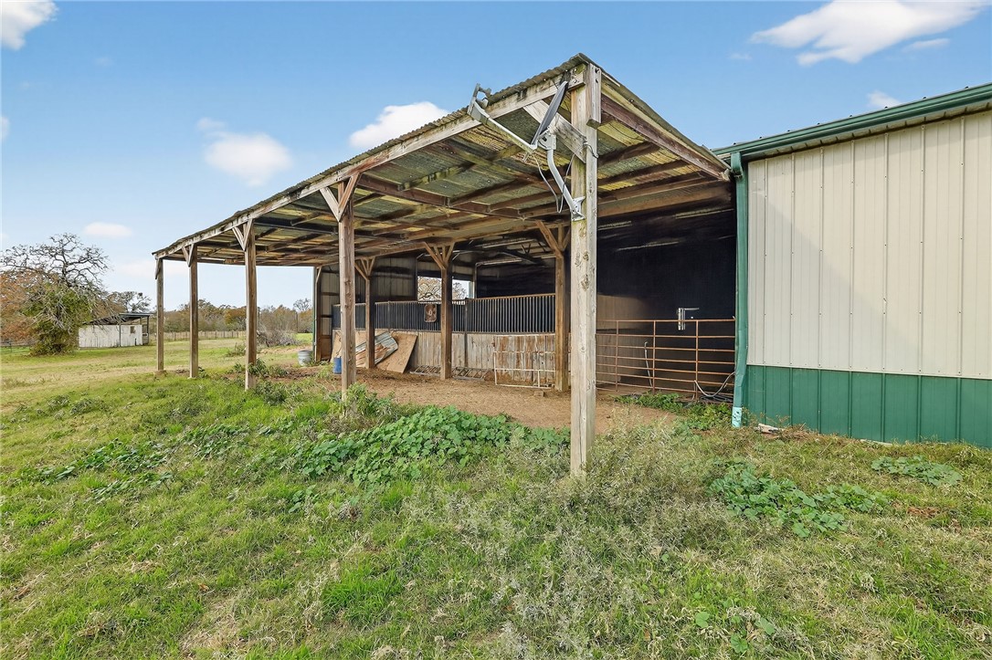 8601 Sandy Point Road Bryan, TX 77807 - Photo 15 of 50 a view of a house with backyard and porch
