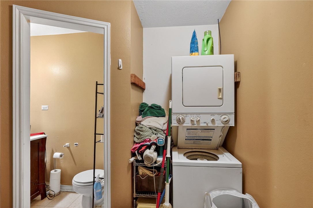 8601 Sandy Point Road Bryan, TX 77807 - Photo 20 of 50 a bathroom with a toilet and a mirror