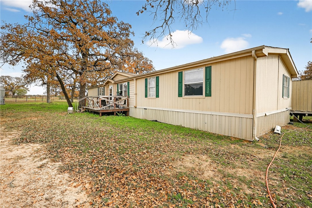 8601 Sandy Point Road Bryan, TX 77807 - Photo 24 of 50 a view of a house with a backyard