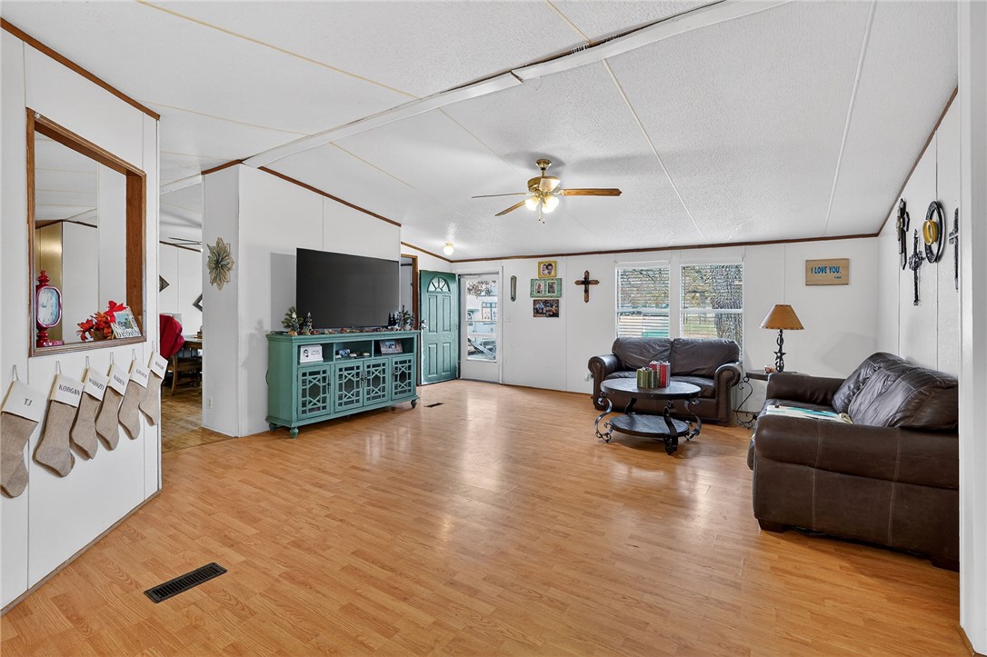 8601 Sandy Point Road Bryan, TX 77807 - Photo 25 of 50 a living room with furniture and a flat screen tv