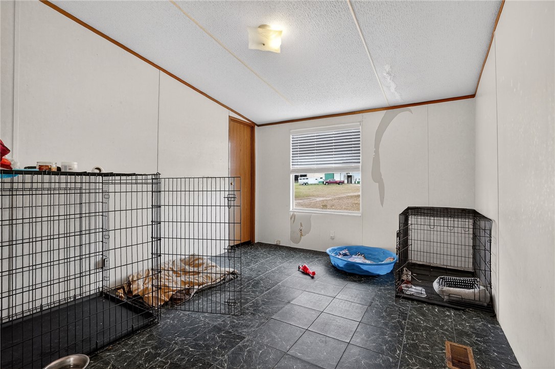 8601 Sandy Point Road Bryan, TX 77807 - Photo 35 of 50 a bedroom with furniture and a window