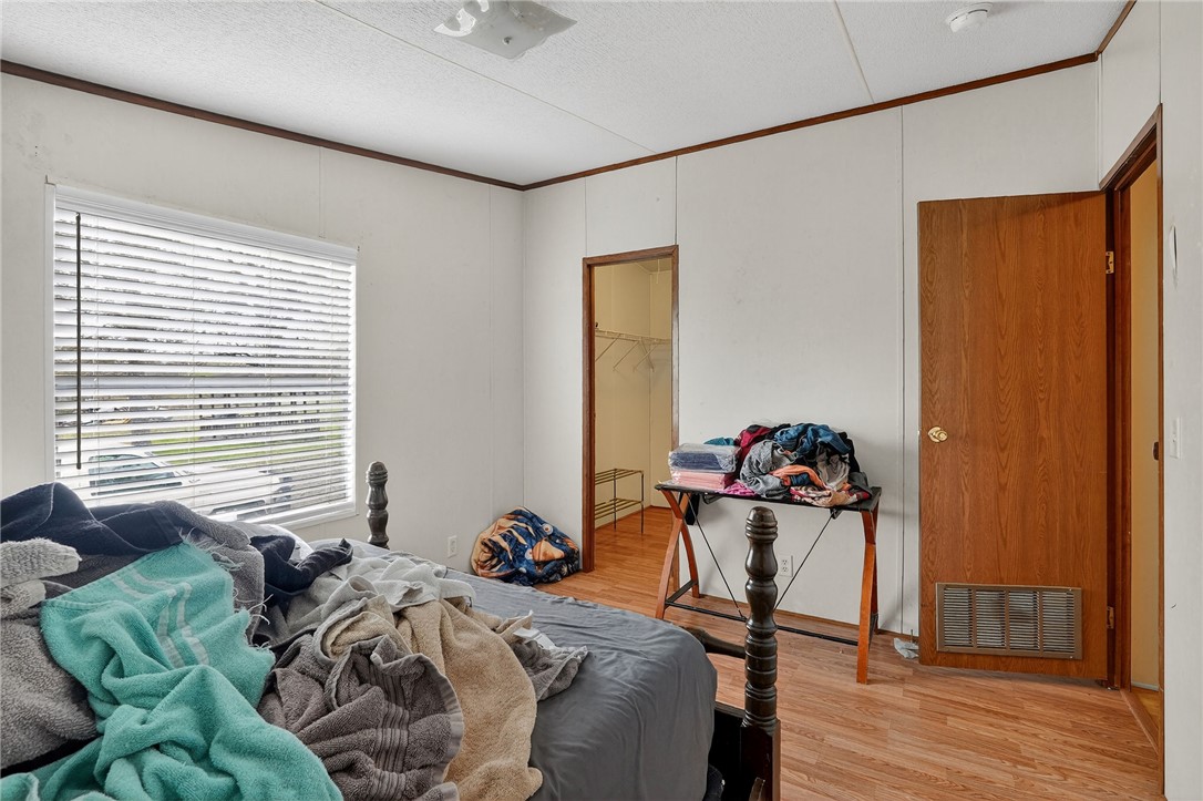 8601 Sandy Point Road Bryan, TX 77807 - Photo 37 of 50 a bedroom with two beds and a window