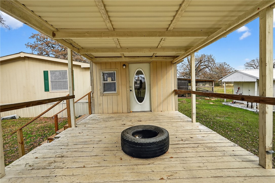 8601 Sandy Point Road Bryan, TX 77807 - Photo 43 of 50 a front view of a house with garden