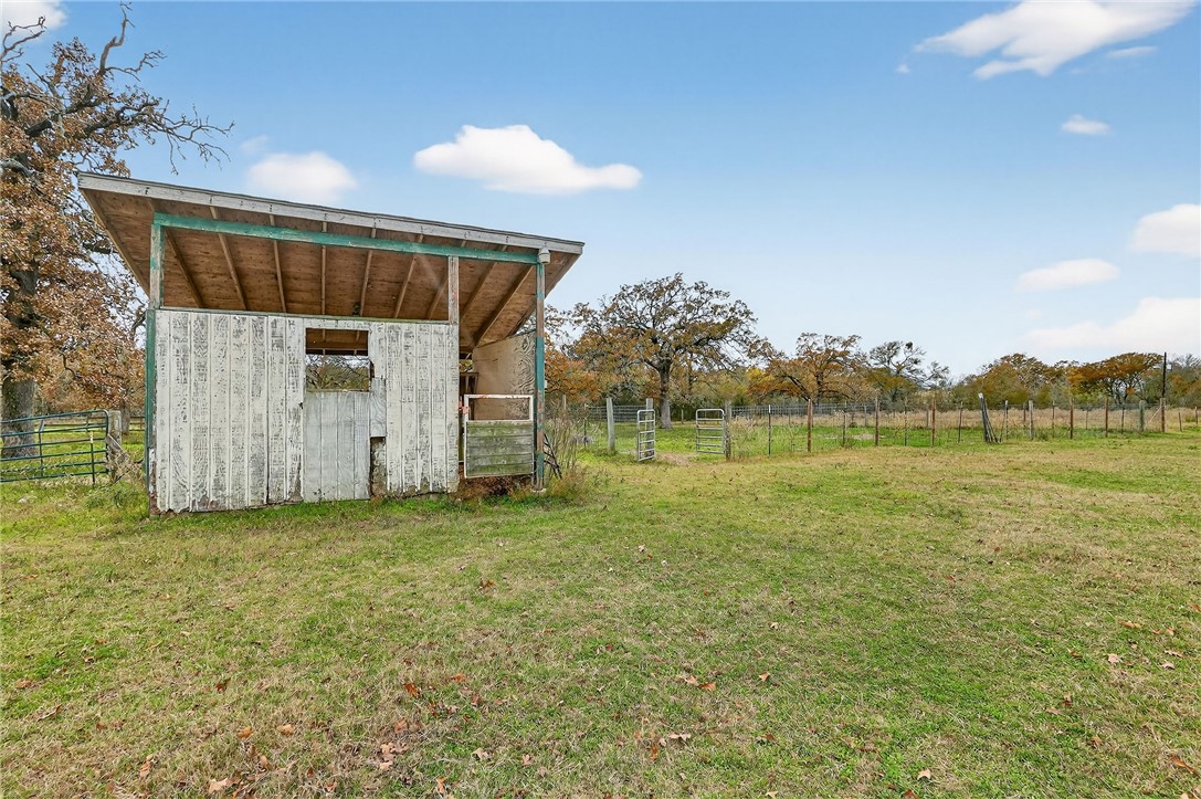 8601 Sandy Point Road Bryan, TX 77807 - Photo 5 of 50 a view of a house with a yard