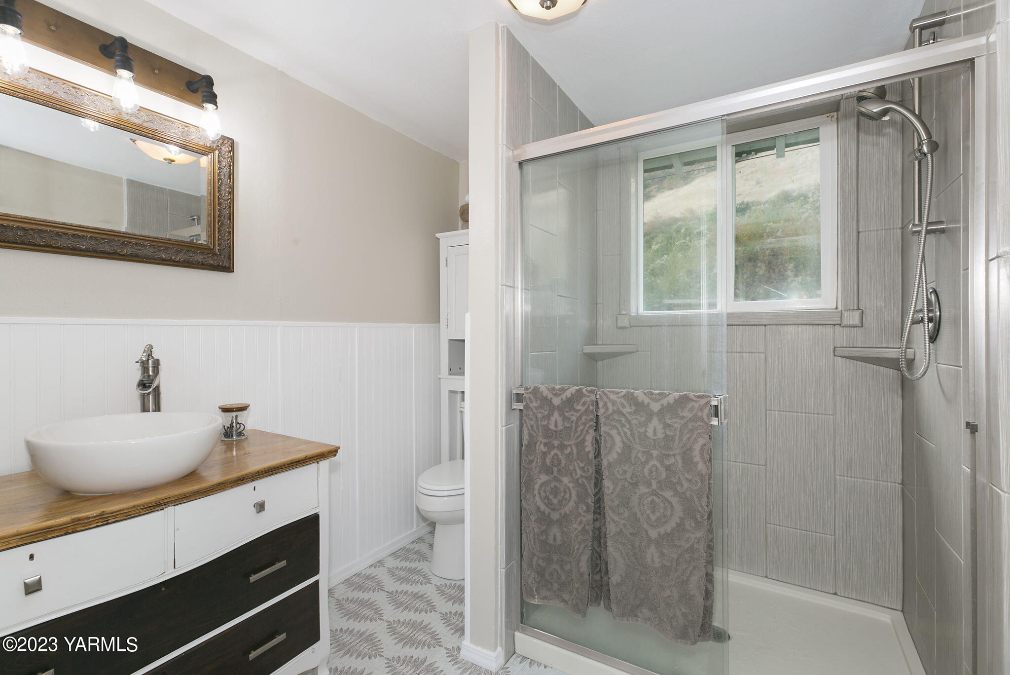 200 Ranger Road Naches, WA 98937 - Photo 11 of 23 a bathroom with a granite countertop sink a toilet and shower