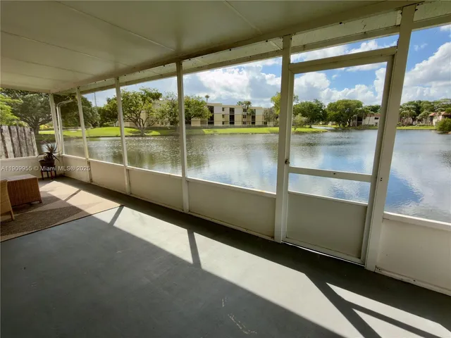 a view of a room with window and wooden floor