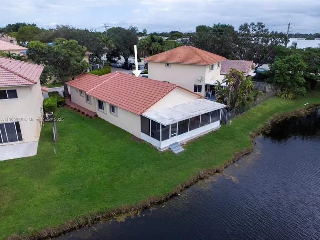 an aerial view of a house with a garden