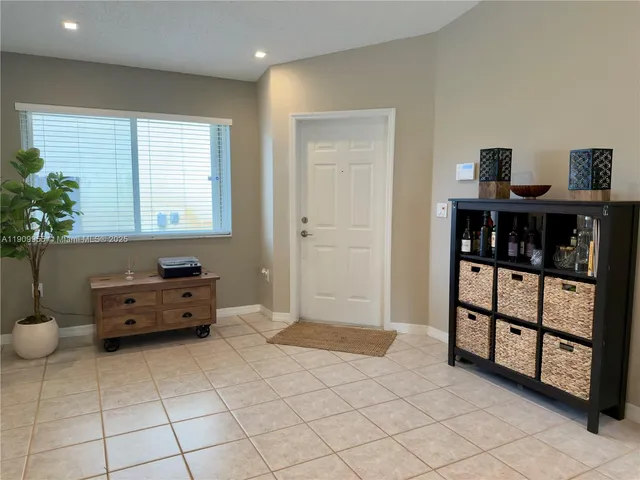a view of room with window and furniture
