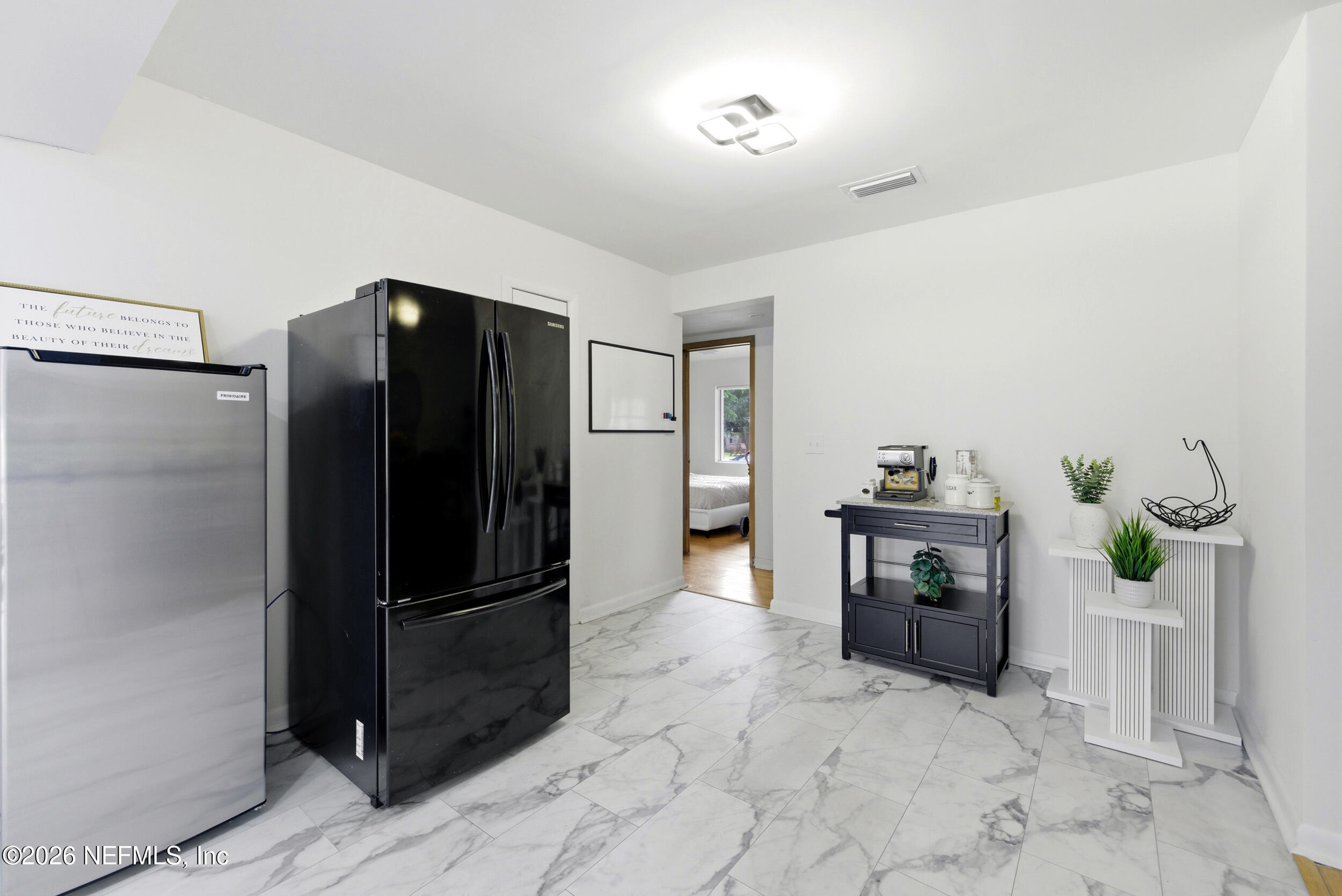 7484 Spinola Road Jacksonville, FL 32217 - Photo 21 of 63 a kitchen with stainless steel appliances a refrigerator and a counter top space