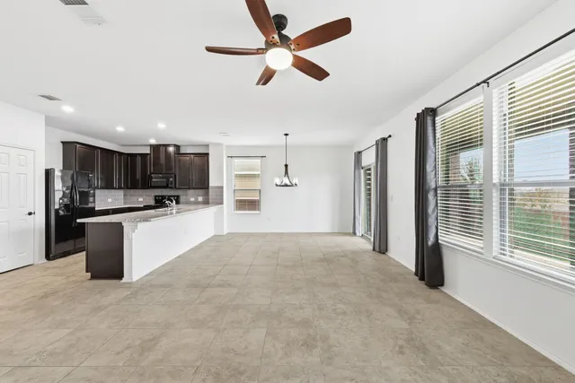 a view of a kitchen with a sink and cabinets