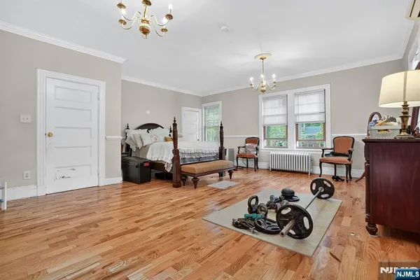 a bed room with furniture window and wooden floor