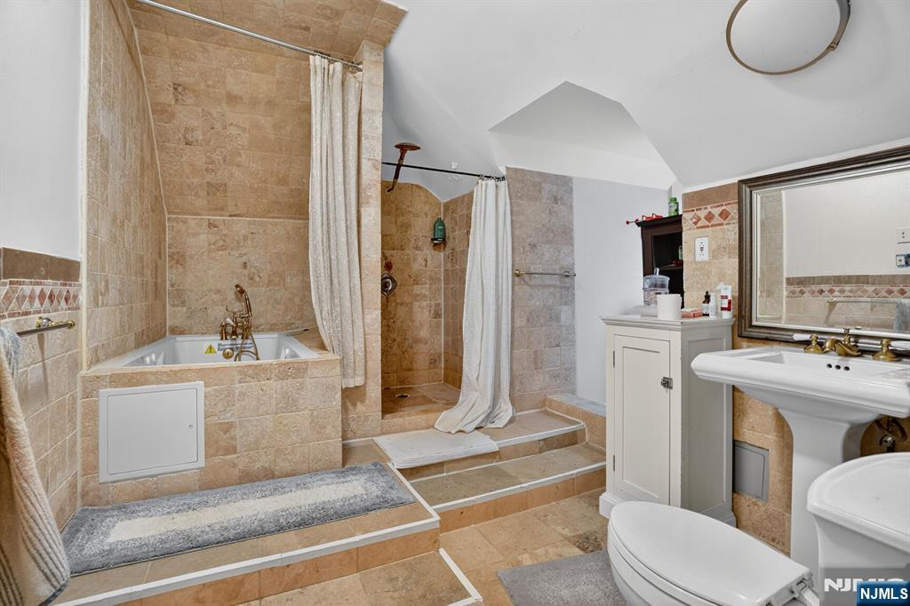 285 Maple Street Englewood, NJ 07631 - Photo 19 of 29 a bathroom with a sink toilet and shower