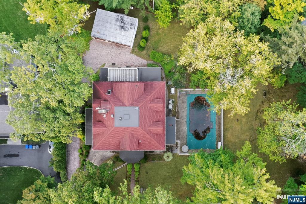 285 Maple Street Englewood, NJ 07631 - Photo 27 of 29 an aerial view of a house with a yard and tree s