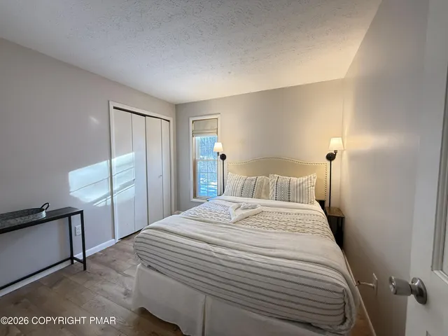 a bedroom with a bed and a couch