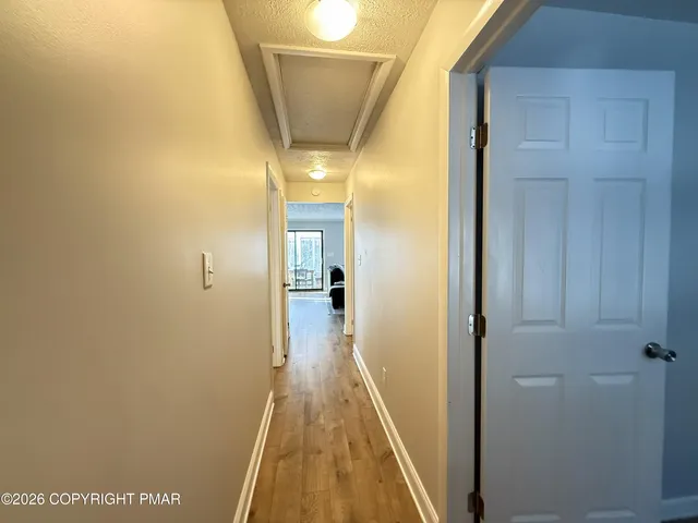 a bedroom with a bed and flat screen tv