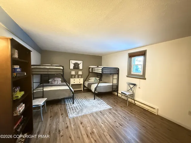 a living room with patio furniture and a large window