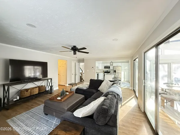 a spacious bedroom with a bed and a couch