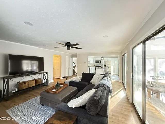 a spacious bedroom with a bed and a couch