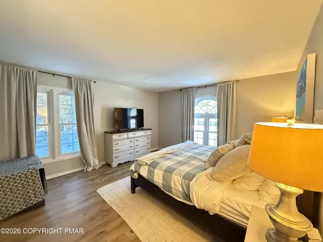 a bedroom with a bed and a closet