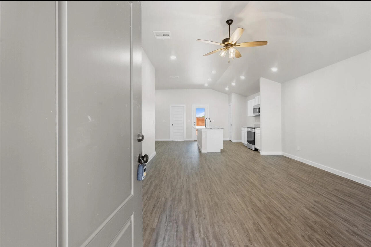 2137 Langford Avenue Lubbock, TX 79407 - Photo 3 of 12 a view of an empty room and kitchen view