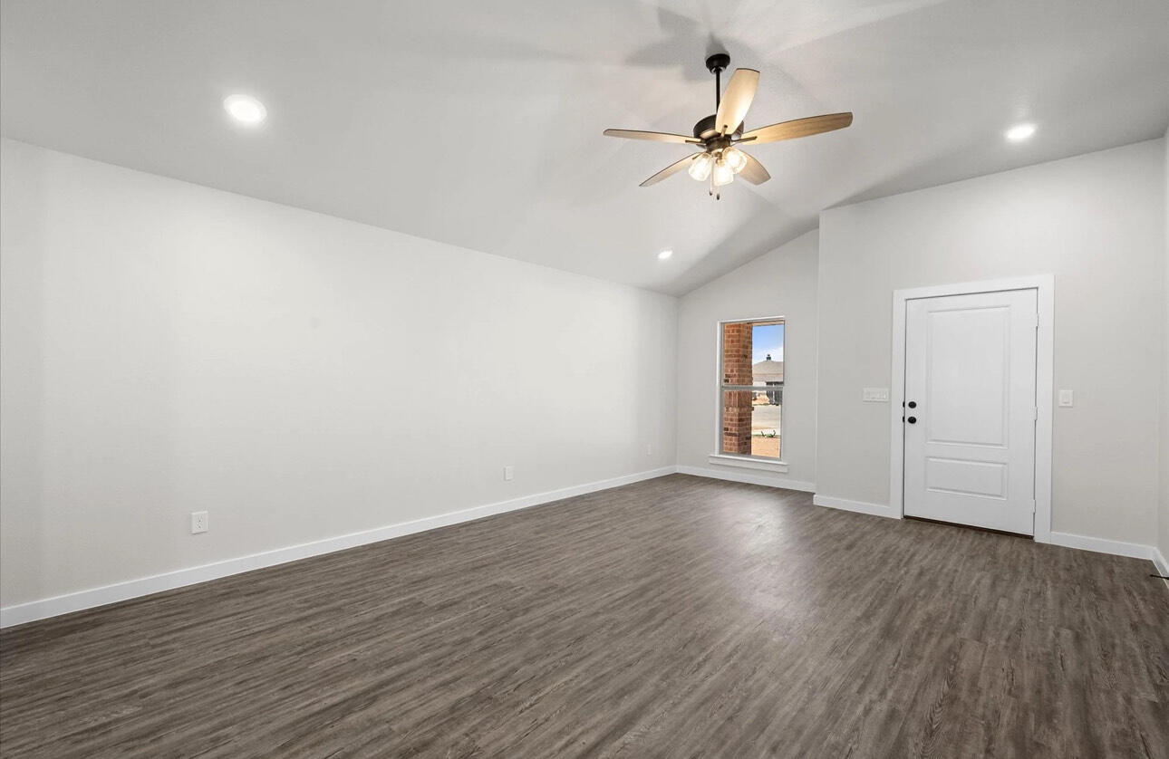 2137 Langford Avenue Lubbock, TX 79407 - Photo 4 of 12 a view of an empty room with wooden floor