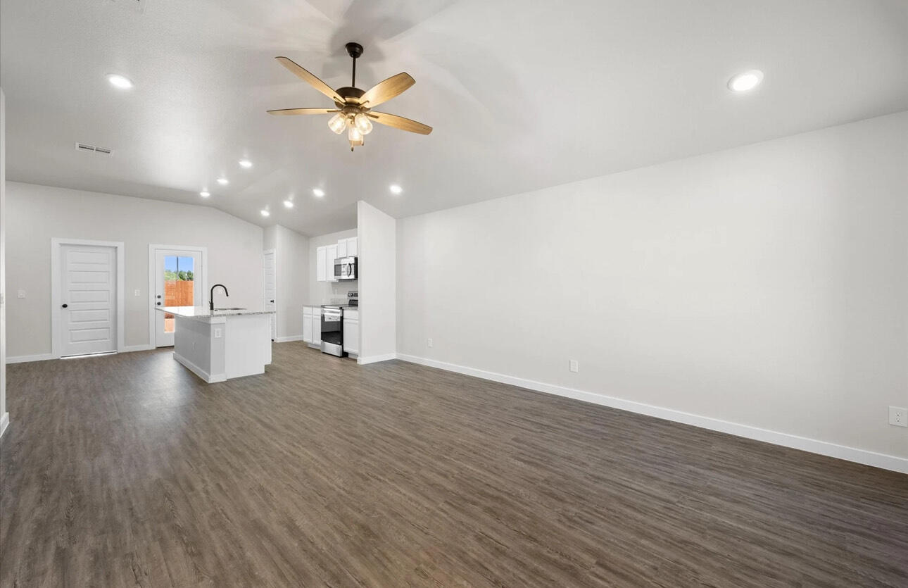 2137 Langford Avenue Lubbock, TX 79407 - Photo 6 of 12 wooden floor in an empty room with a window