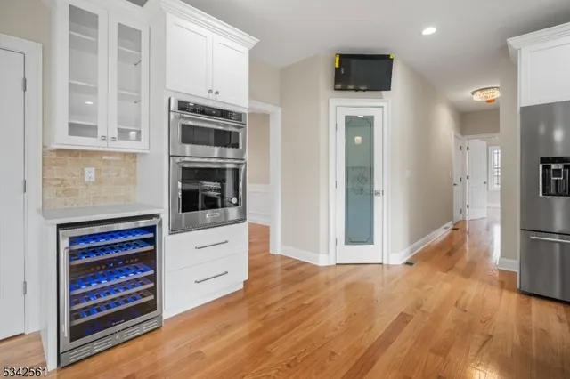 a kitchen with stainless steel appliances a stove and a refrigerator