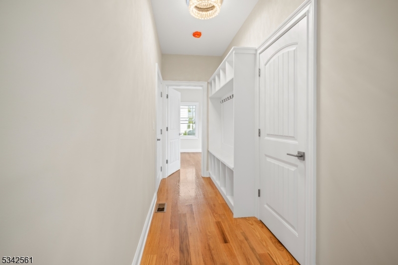 118 Cambridge Road Westfield, NJ 07090 - Photo 15 of 50 a view of a hallway with wooden floor and entryway