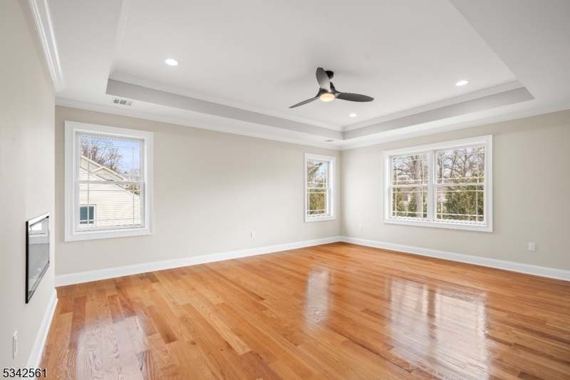 118 Cambridge Road Westfield, NJ 07090 - Photo 19 of 50 a view of an empty room with a window and wooden floor