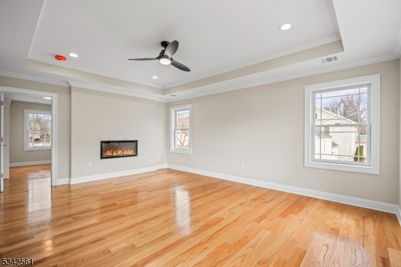 118 Cambridge Road Westfield, NJ 07090 - Photo 20 of 50 a view of an empty room with wooden floor and a window