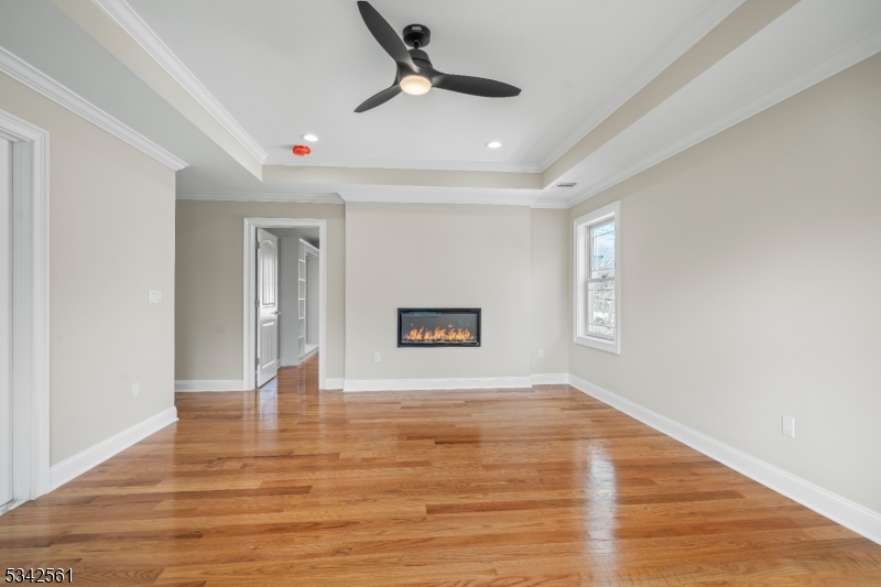 118 Cambridge Road Westfield, NJ 07090 - Photo 21 of 50 a view of an empty room with window and wooden floor