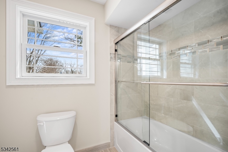 118 Cambridge Road Westfield, NJ 07090 - Photo 23 of 50 a bathroom with a toilet and a shower