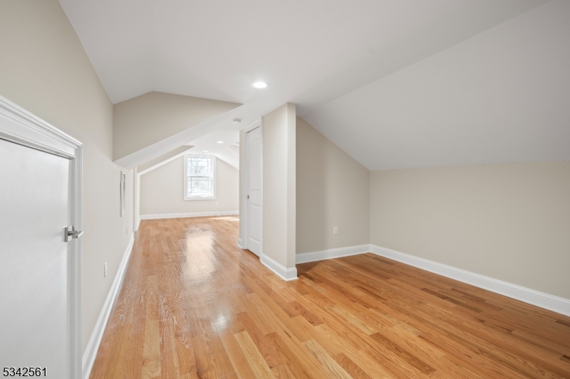 118 Cambridge Road Westfield, NJ 07090 - Photo 30 of 50 wooden floor in an empty room with a window