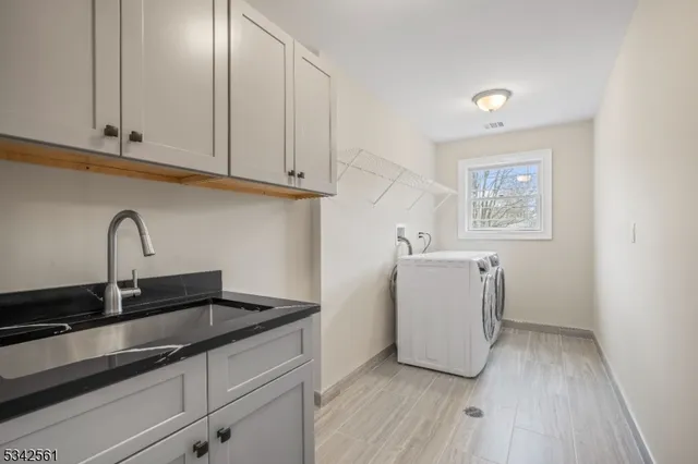 a kitchen with a sink and cabinets