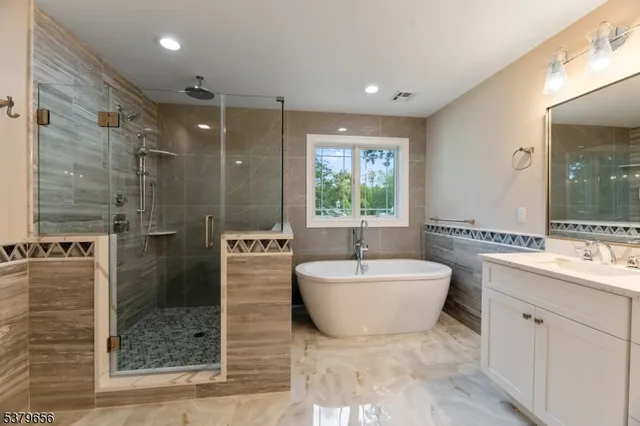 a bathroom with a toilet a sink and a mirror