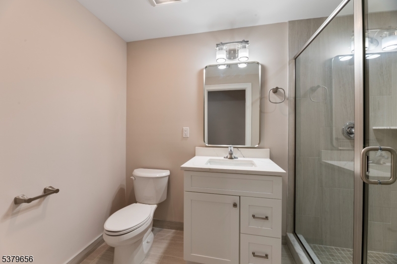 118 Cambridge Road Westfield, NJ 07090 - Photo 44 of 50 a bathroom with a toilet a sink and mirror