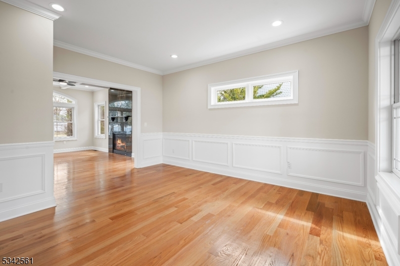 118 Cambridge Road Westfield, NJ 07090 - Photo 6 of 50 a view of an empty room with wooden floor and a window