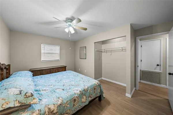 a bedroom with a large bed and a window