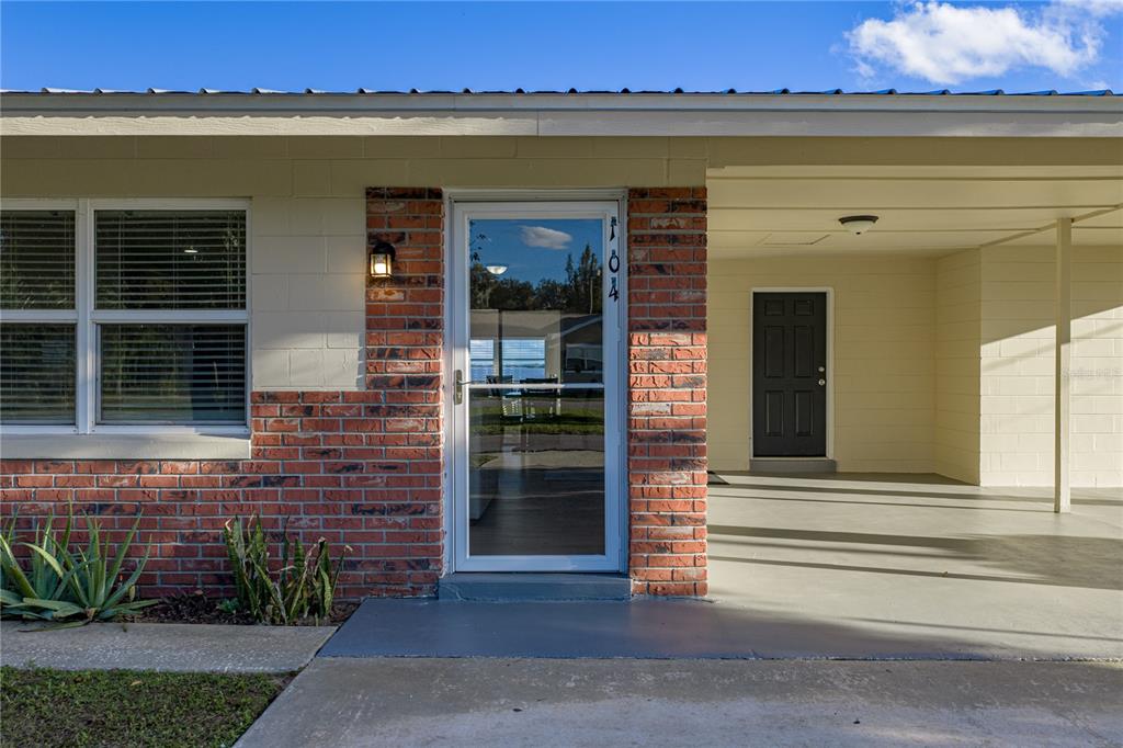 104 North Lake Reedy Boulevard Frostproof, FL 33843 - Photo 2 of 50 a view of a entryway of the building