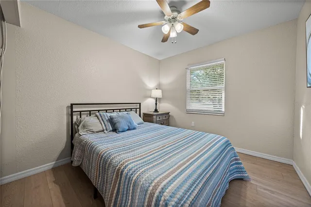 a bedroom with a bed and window