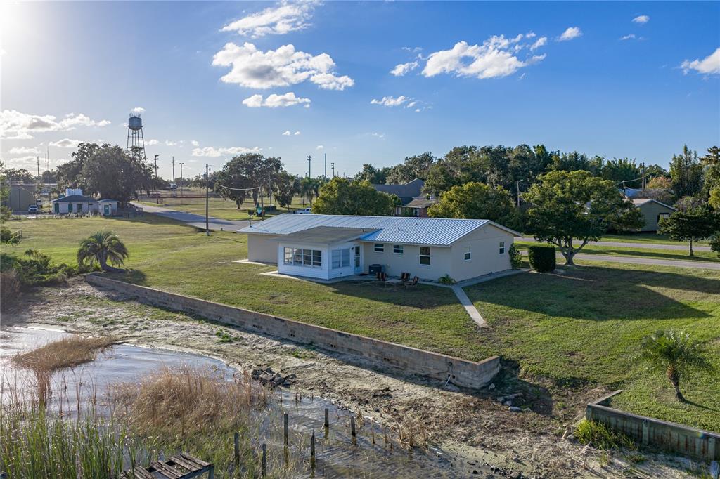 104 North Lake Reedy Boulevard Frostproof, FL 33843 - Photo 30 of 50 a view of a house with a yard
