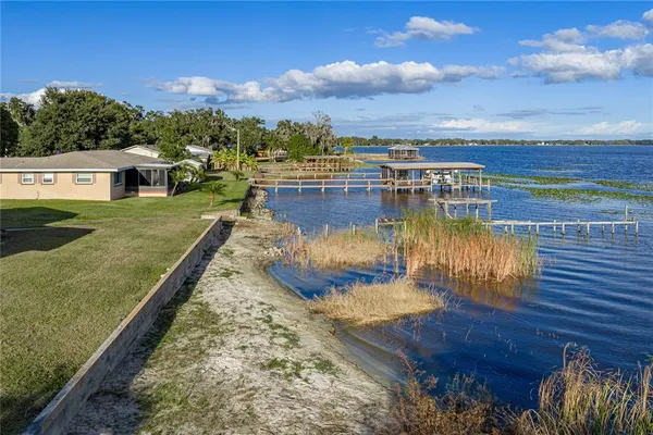 a view of a swimming pool with an outdoor seating
